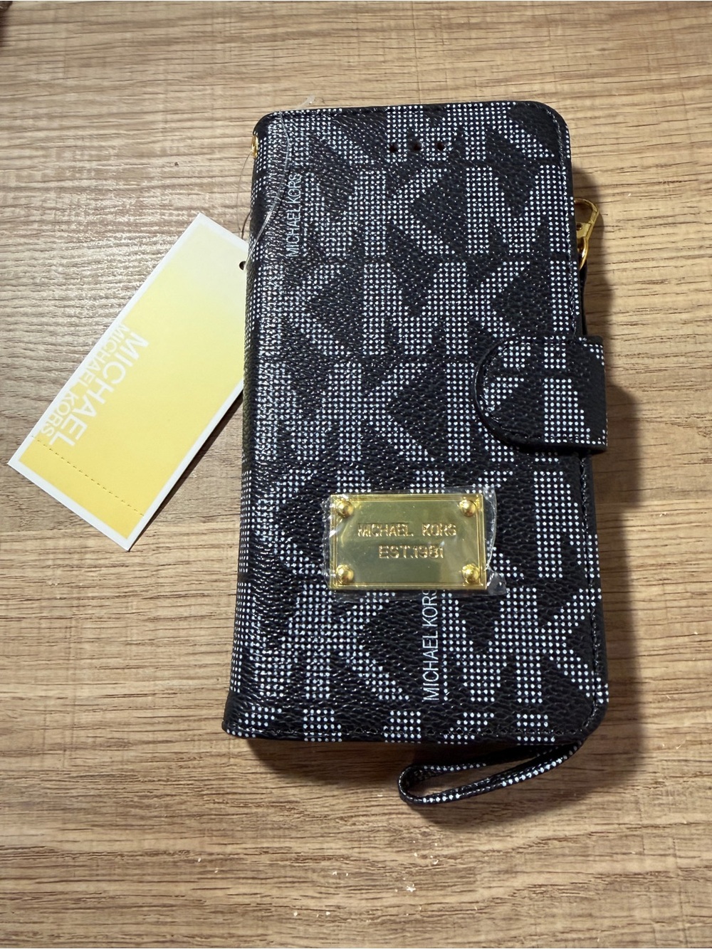 Michael Kors Black, White, or Brown Monogram Phone Wallet with Gold Plate